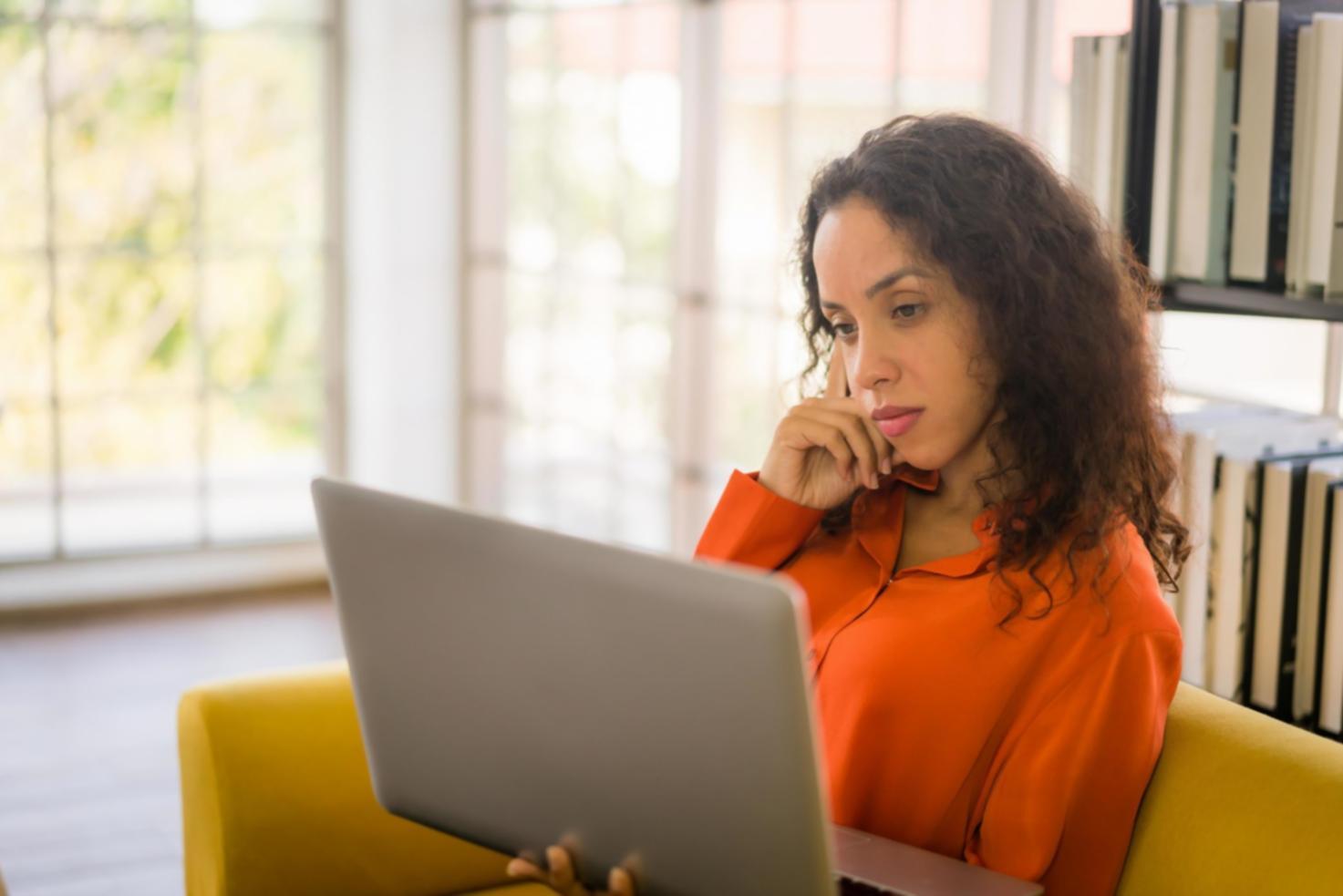 Financial analyst reviewing integrated data dashboard with real-time market information