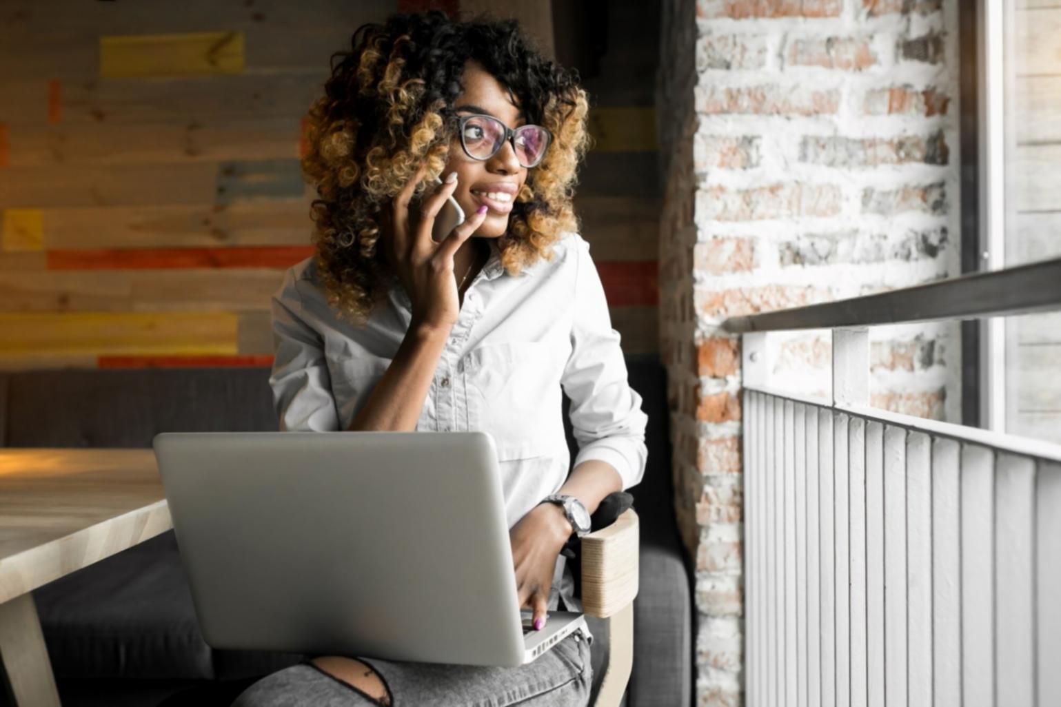 Financial analyst reviewing market data trends and statistical models on multiple monitors